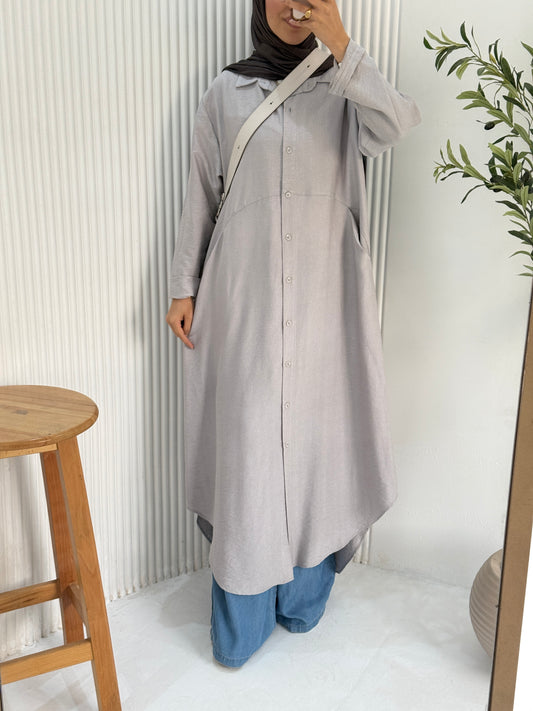 Amenaa grey shirt dress with long sleeves and collar, shown on a mannequin. Stylish and comfortable casual dress.
