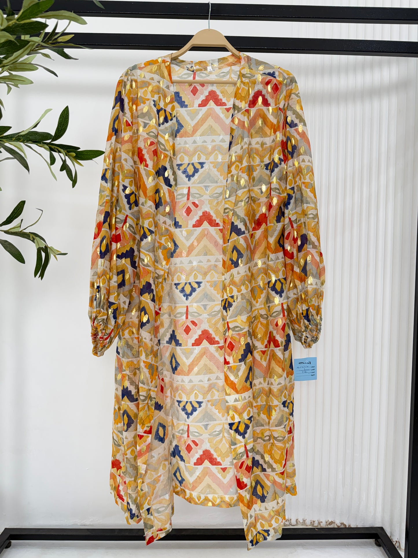 Yellow printed kimono from Amenaa with floral patterns, lightweight fabric, and wide sleeves, casual and stylish for summer wear.
