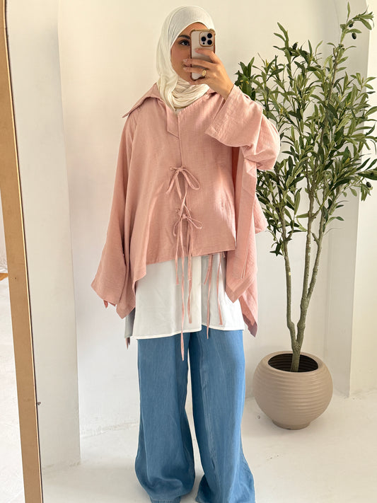 Amenaa Ribbons Shirt featuring a stylish design with ribbon accents, shown on a model wearing a trendy, casual outfit.