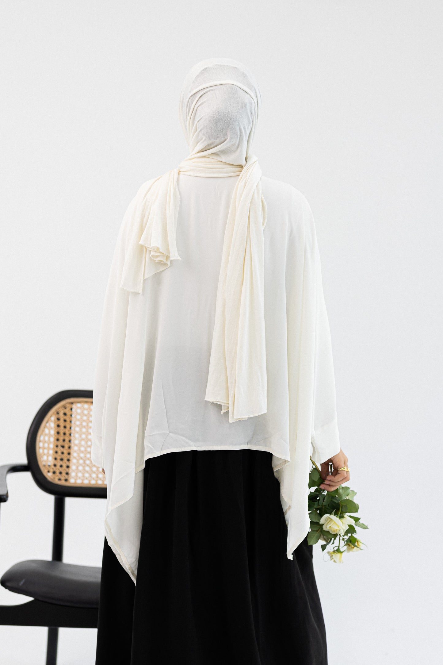Amenaa ruffles blouse with long sleeves and feminine ruffle details, displayed on a neutral background.