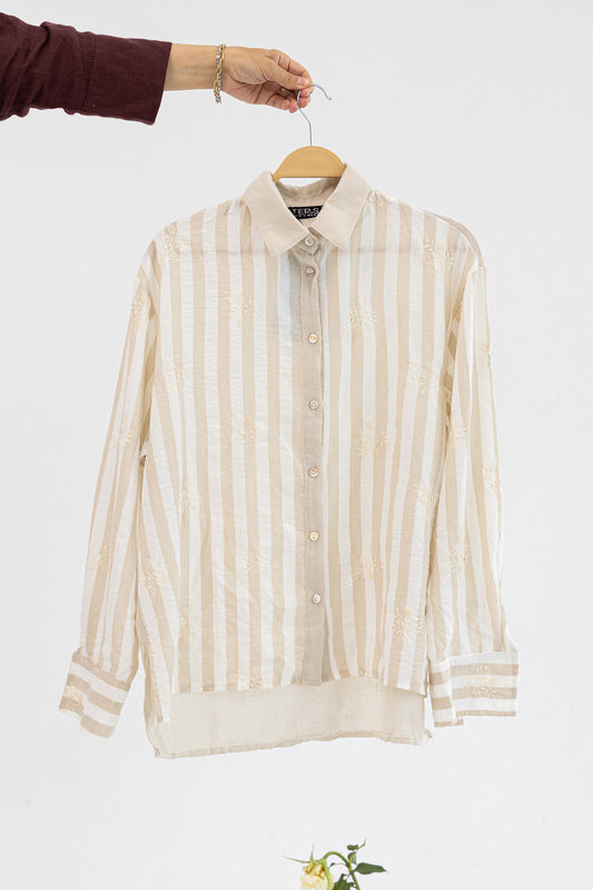 Amenaa striped embroidered shirt with colorful pattern, button-up design, and long sleeves, displayed on a hanger.