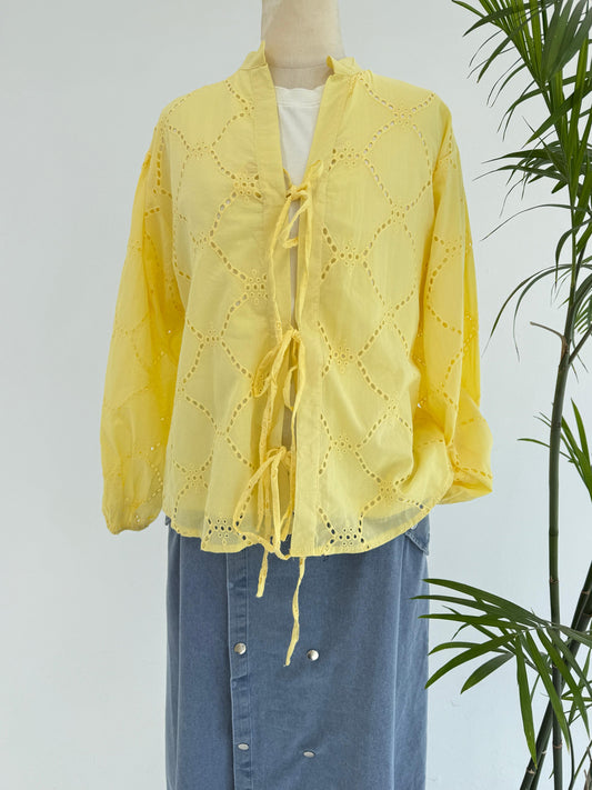 Amenaa Summer Rokama Tie Blouse in lightweight fabric, featuring a stylish tie detail and relaxed fit, perfect for warm weather.