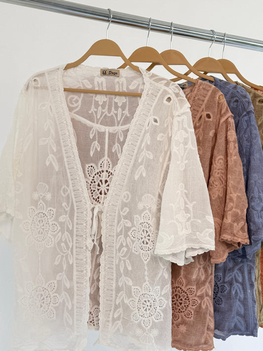 Embroidered lace Amenaa kimono with floral patterns, flowing fabric, and intricate detailing, displayed on a neutral background.