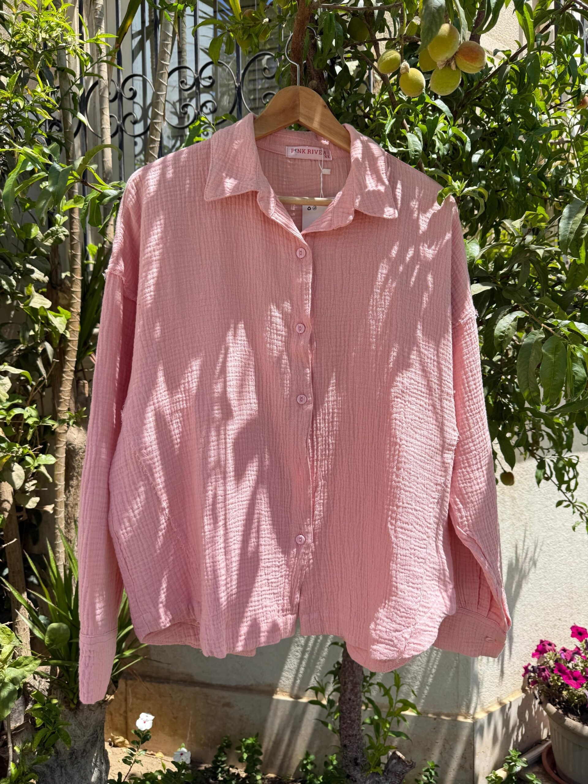 Pink cotton shirt from My Store, featuring a classic fit and button-up design, displayed on a hanger.