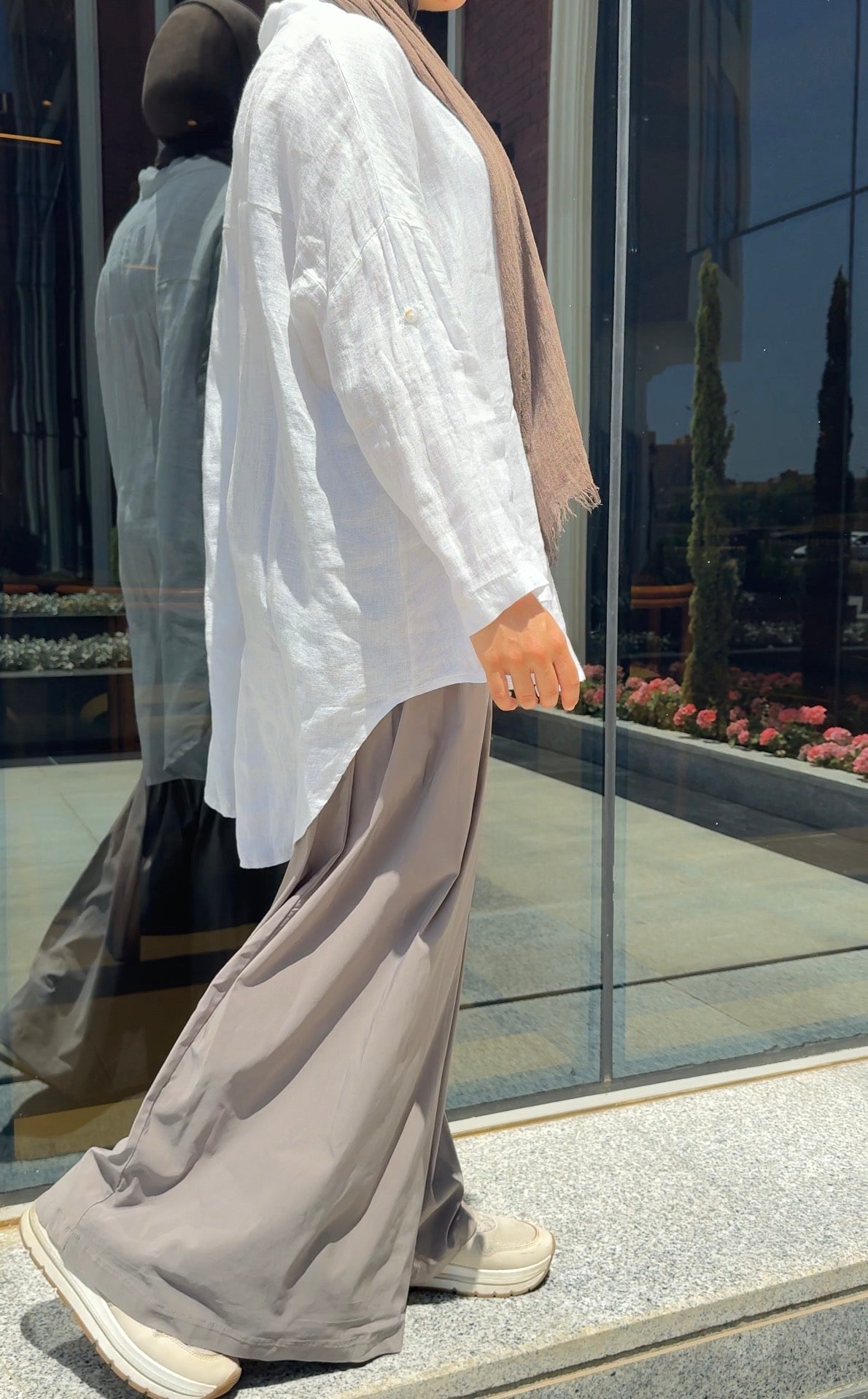 Amenaa linen shirt shown in light, breathable fabric with a relaxed fit and classic collar, styled for casual and summer wear.