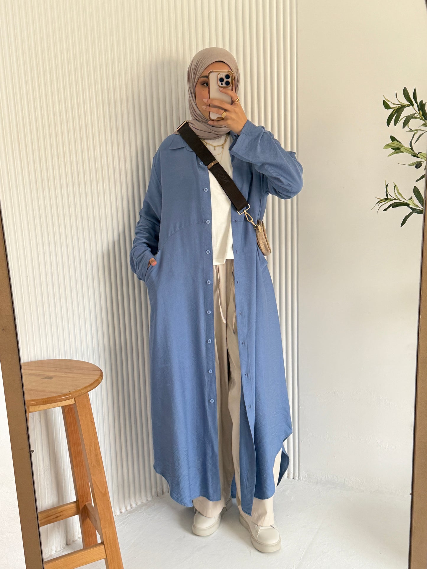 Amenaa shirt dress with long sleeves and a collar, featuring a relaxed fit and button-front design.