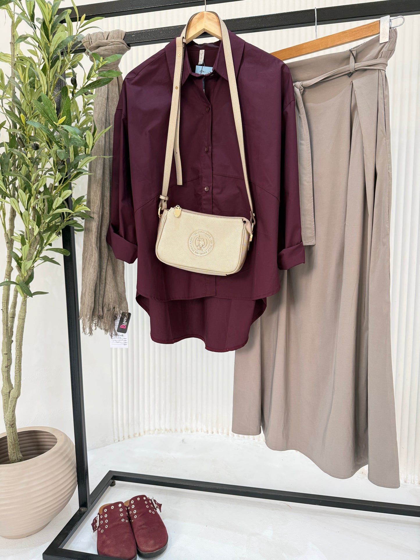 Amenaa oversized poplin shirt in white, featuring a relaxed fit, long sleeves, and classic collar, displayed on a hanger.