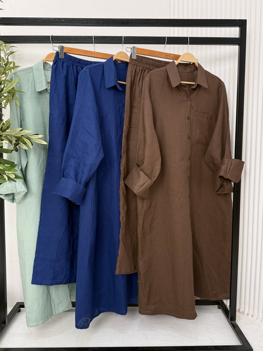 Amenaa pure linen shirt dress displayed on a hanger, showcasing its relaxed fit and lightweight, breathable fabric.