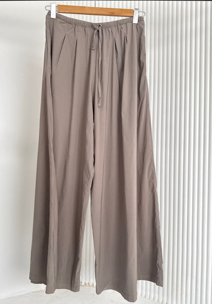 Amenaa wide leg pants in a relaxed fit, showcasing their flowy fabric and stylish silhouette, perfect for casual or chic outfits.