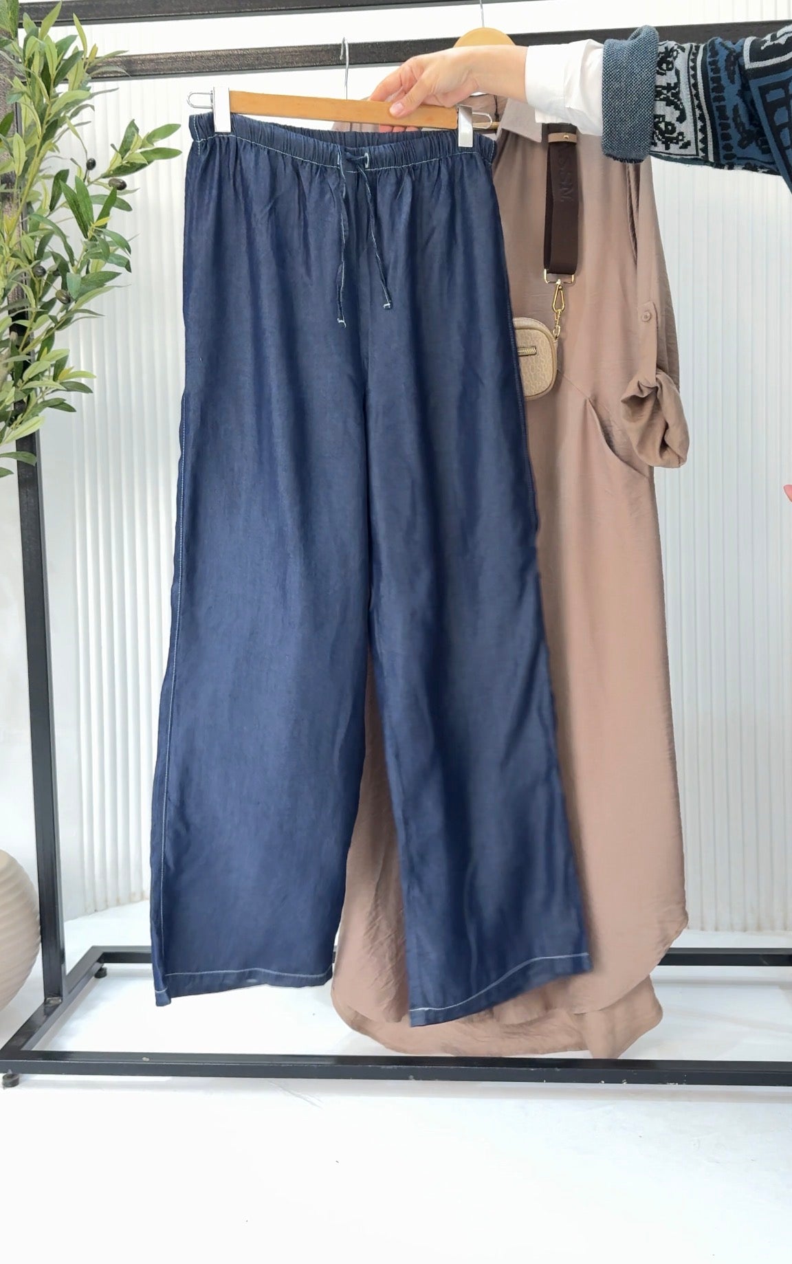 Amenaa Tensile Jeans showing dark denim fabric with a slim fit design and classic five-pocket style.
