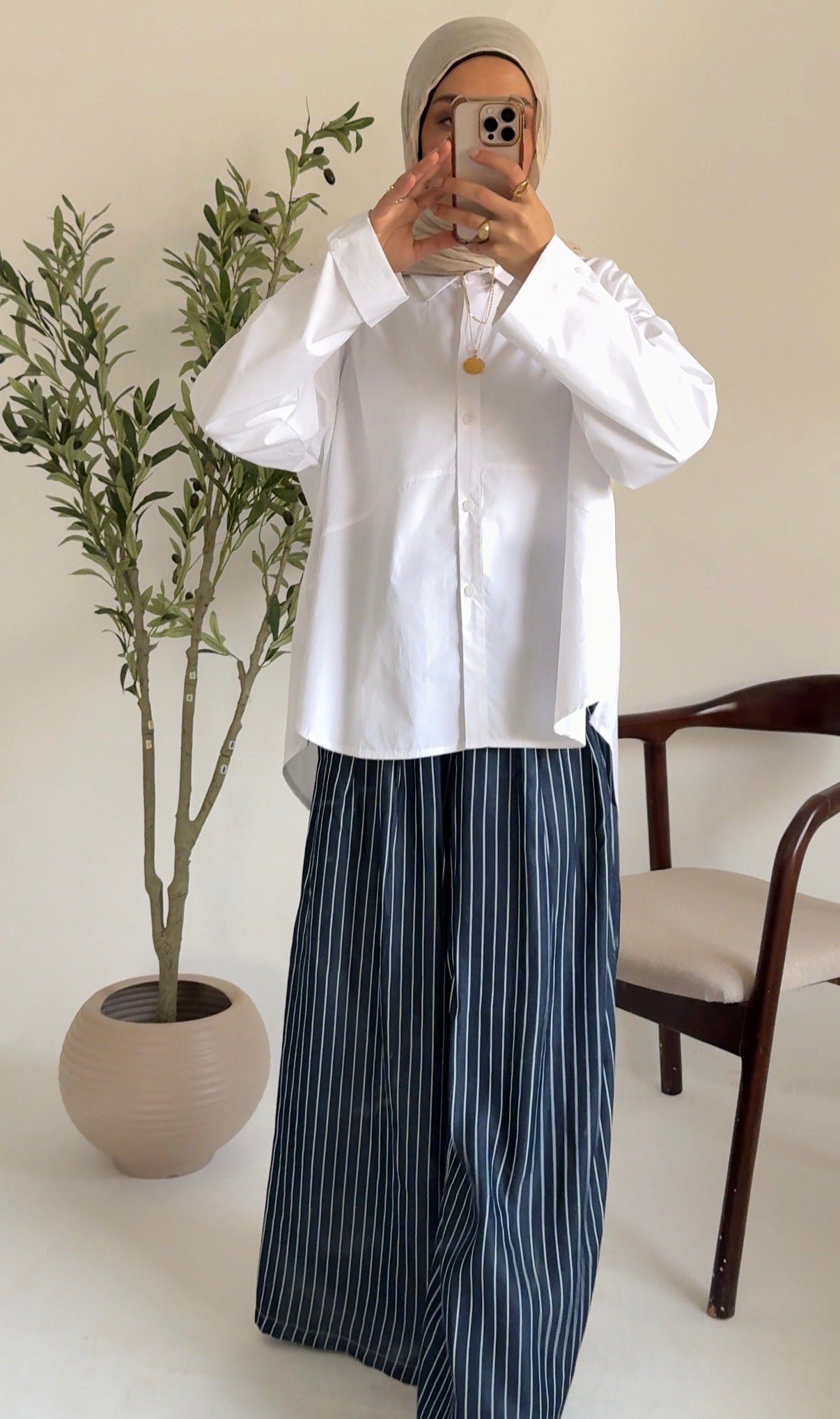 Amenaa oversized poplin shirt in light fabric, shown in a relaxed fit with a classic collar and button front.