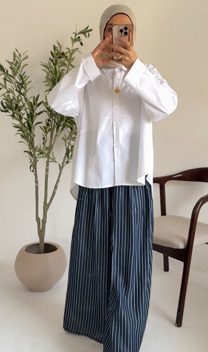 Amenaa oversized poplin shirt in light fabric, shown in a relaxed fit with a classic collar and button front.