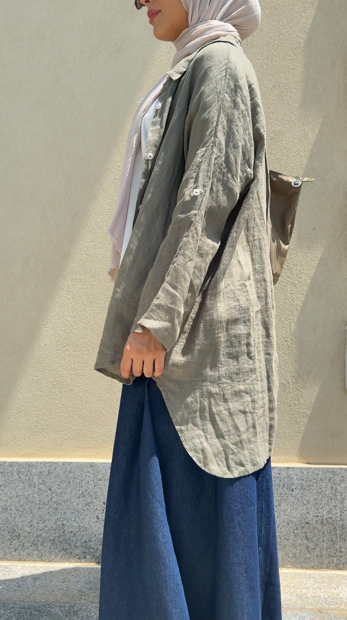 Men's linen shirt by Amenaa, light beige fabric with a relaxed fit, featuring a button-up front and classic collar.