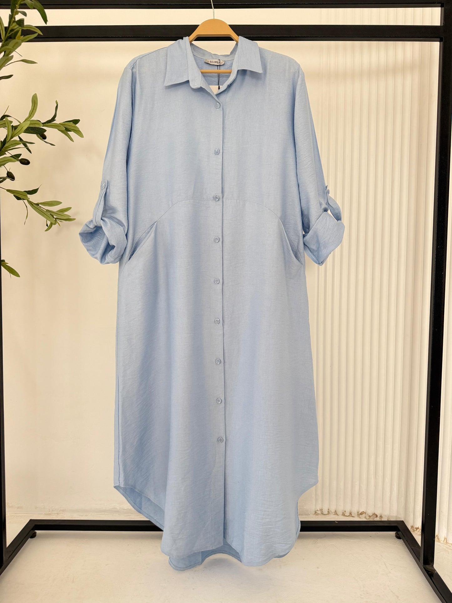 Amenaa shirt dress in lightweight fabric, featuring a relaxed fit, collar neckline, and short sleeves, displayed on a hanger.