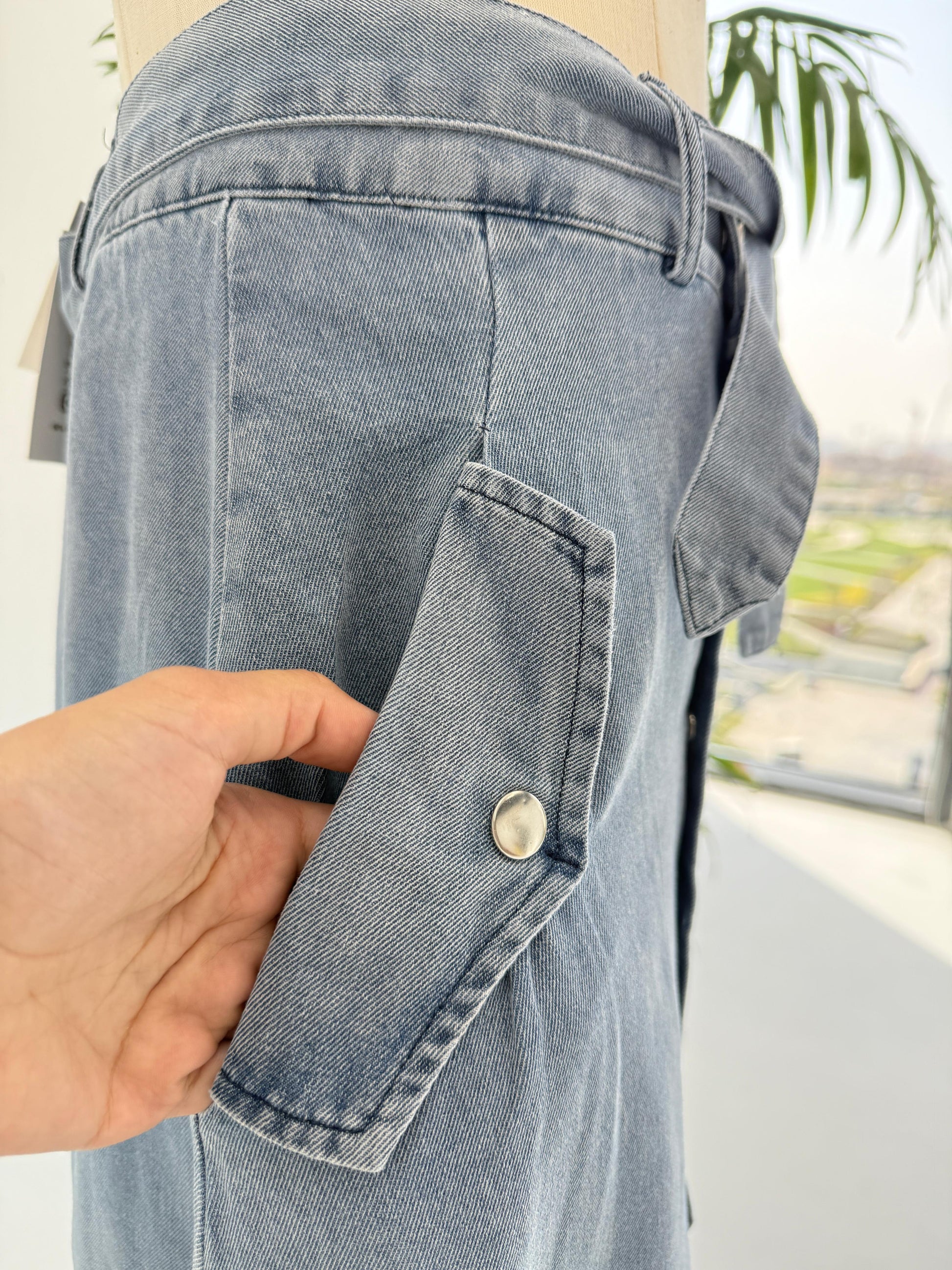 Amenaa button denim skirt with front pockets and metal button closure, casual and trendy denim skirt for women.