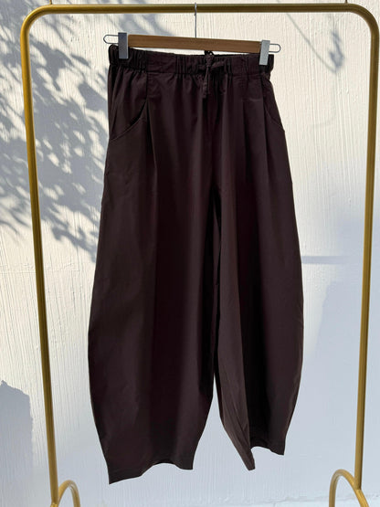 Amenaa balloon pants in lightweight fabric, featuring a relaxed fit with elastic waistband and cuffed hems, stylish and comfortable.