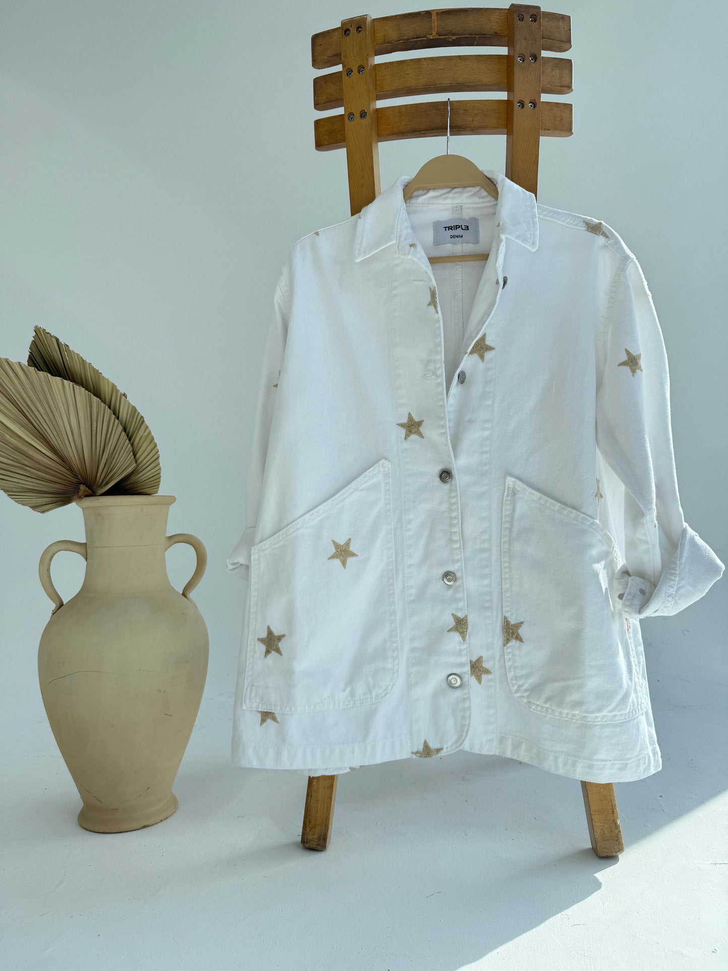 Amenaa star gabardine jacket shown on a hanger, featuring a stylish navy design with star patterns and a tailored fit.