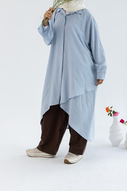 Amenaa Minimal Flow Tunic in neutral fabric, showcasing its simple, elegant design and relaxed fit on a model.