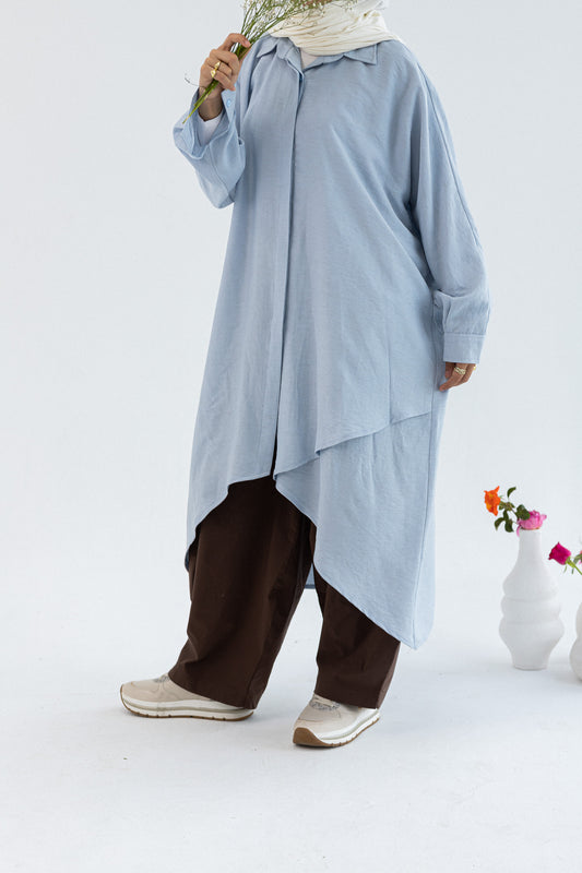 Amenaa Minimal Flow Tunic in neutral fabric, showcasing its simple, elegant design and relaxed fit on a model.