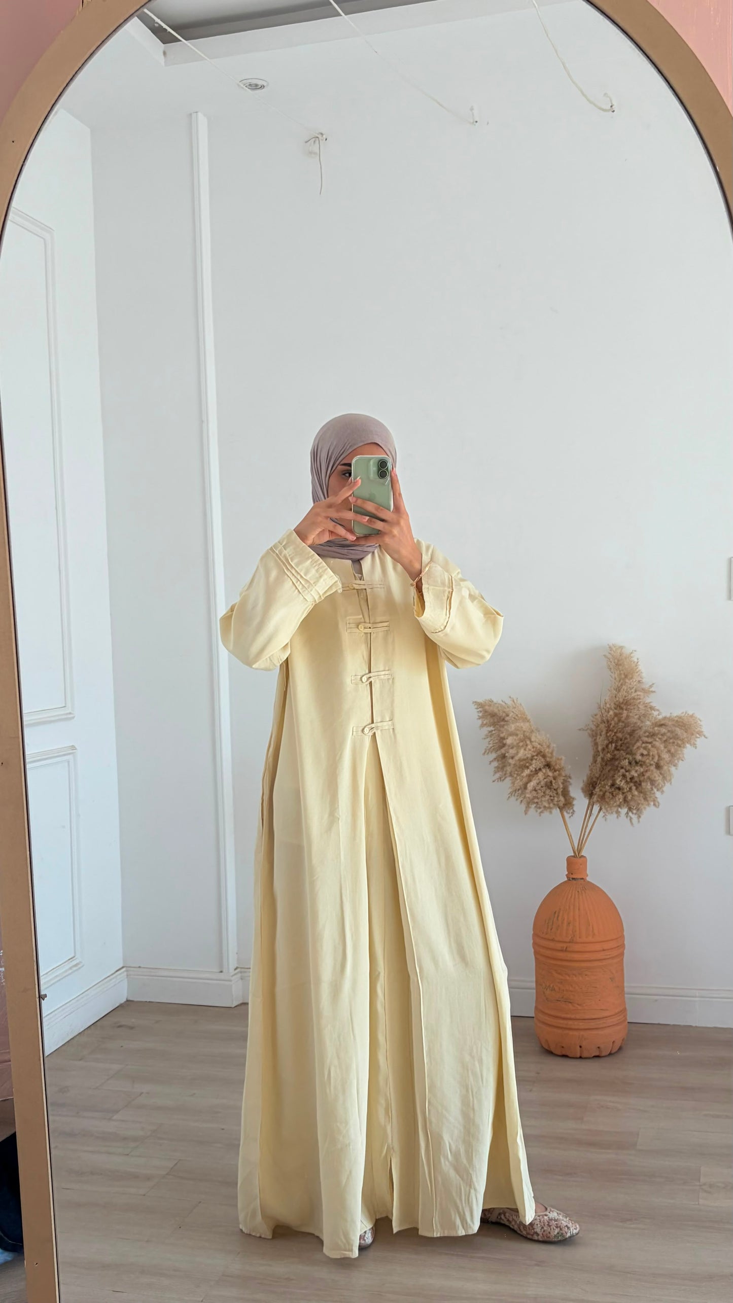 Amenaa modest Tencel dress displayed on a hanger, featuring a flowing, lightweight fabric and a relaxed, elegant fit.