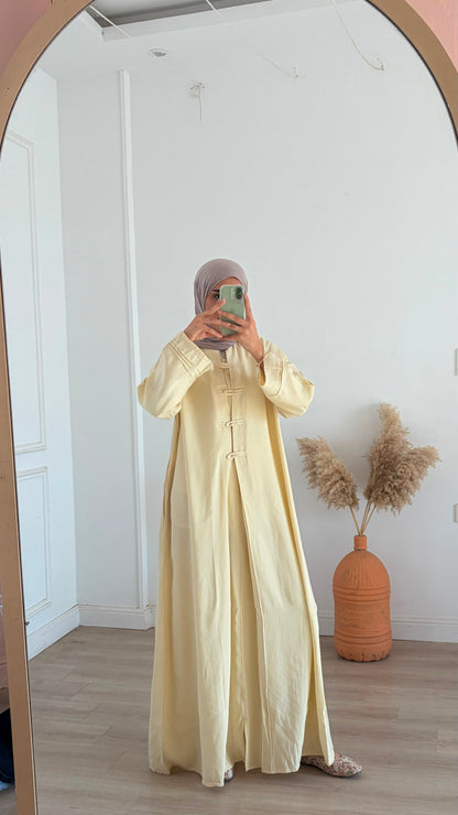 Amenaa modest Tencel dress displayed on a hanger, featuring a flowing, lightweight fabric and a relaxed, elegant fit.