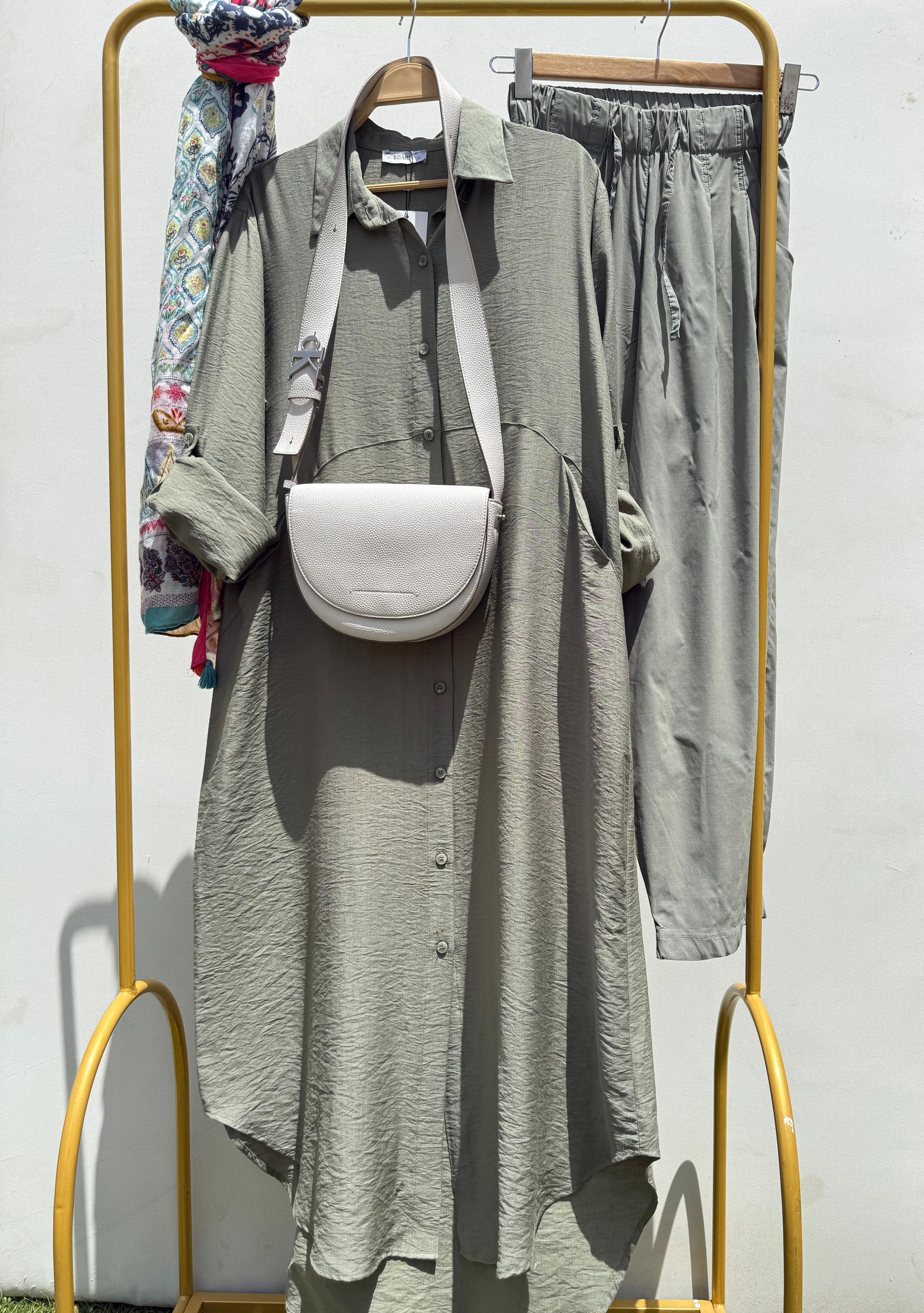 Amenaa shirt dress with a relaxed fit in lightweight fabric, featuring a collar, buttons, and short sleeves.