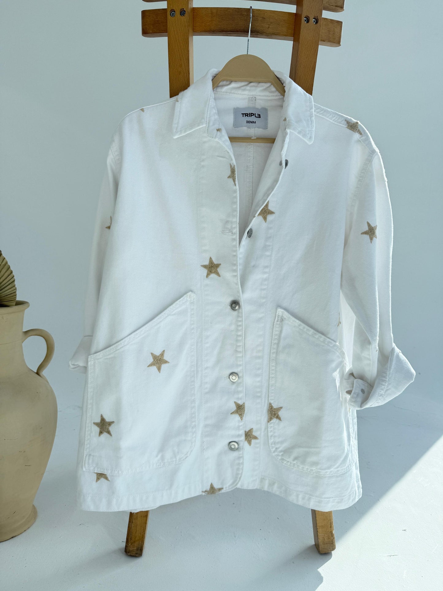 Amenaa Star Gabardine Jacket shown in black with star pattern, featuring a classic collar, button front, and tailored fit.