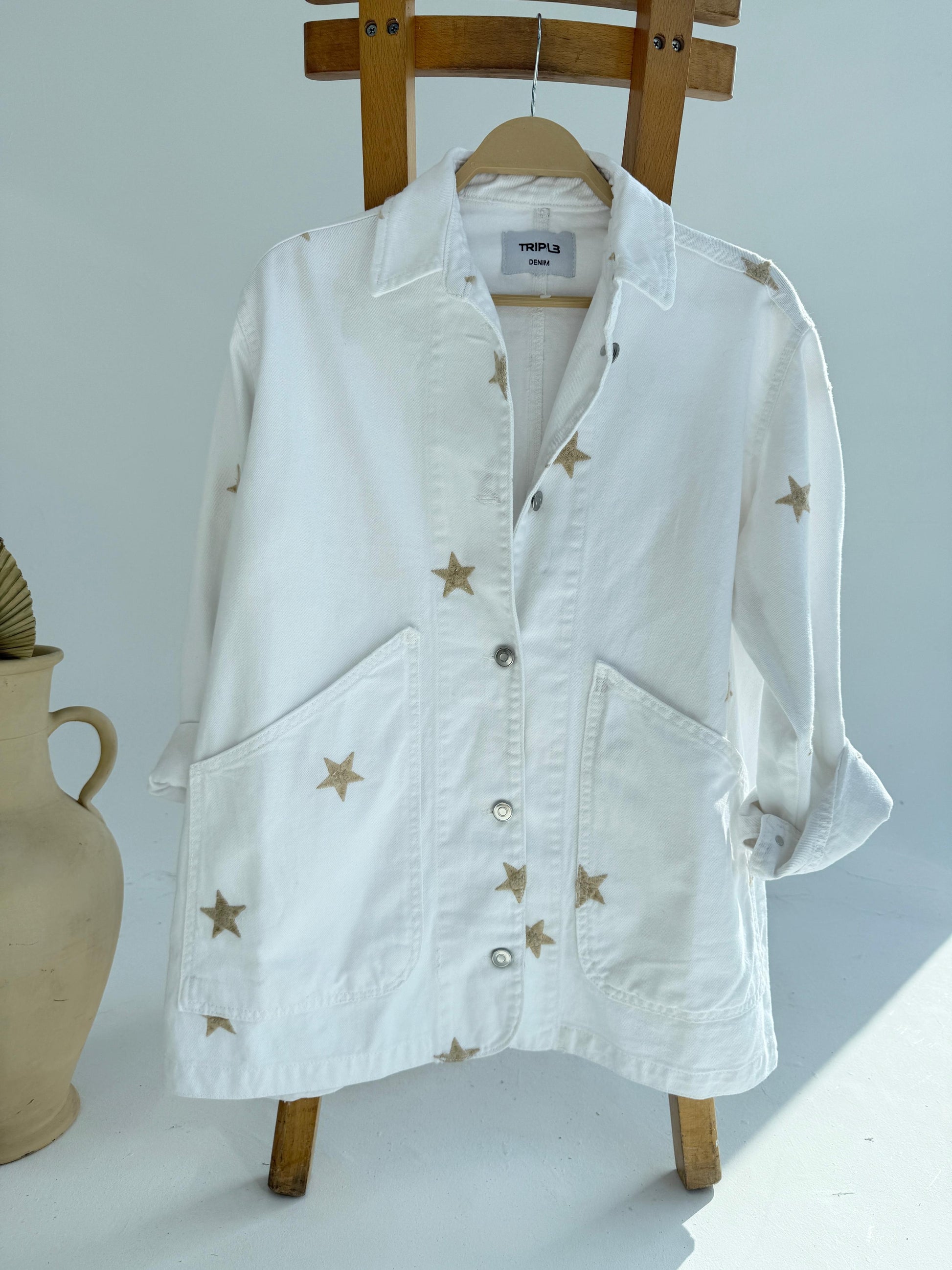 Amenaa Star Gabardine Jacket shown in black with star pattern, featuring a classic collar, button front, and tailored fit.