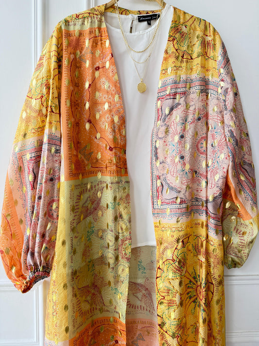 Printed Amenaa Kimono with floral patterns, flowing fabric, and wide sleeves, perfect for stylish, comfortable wear.