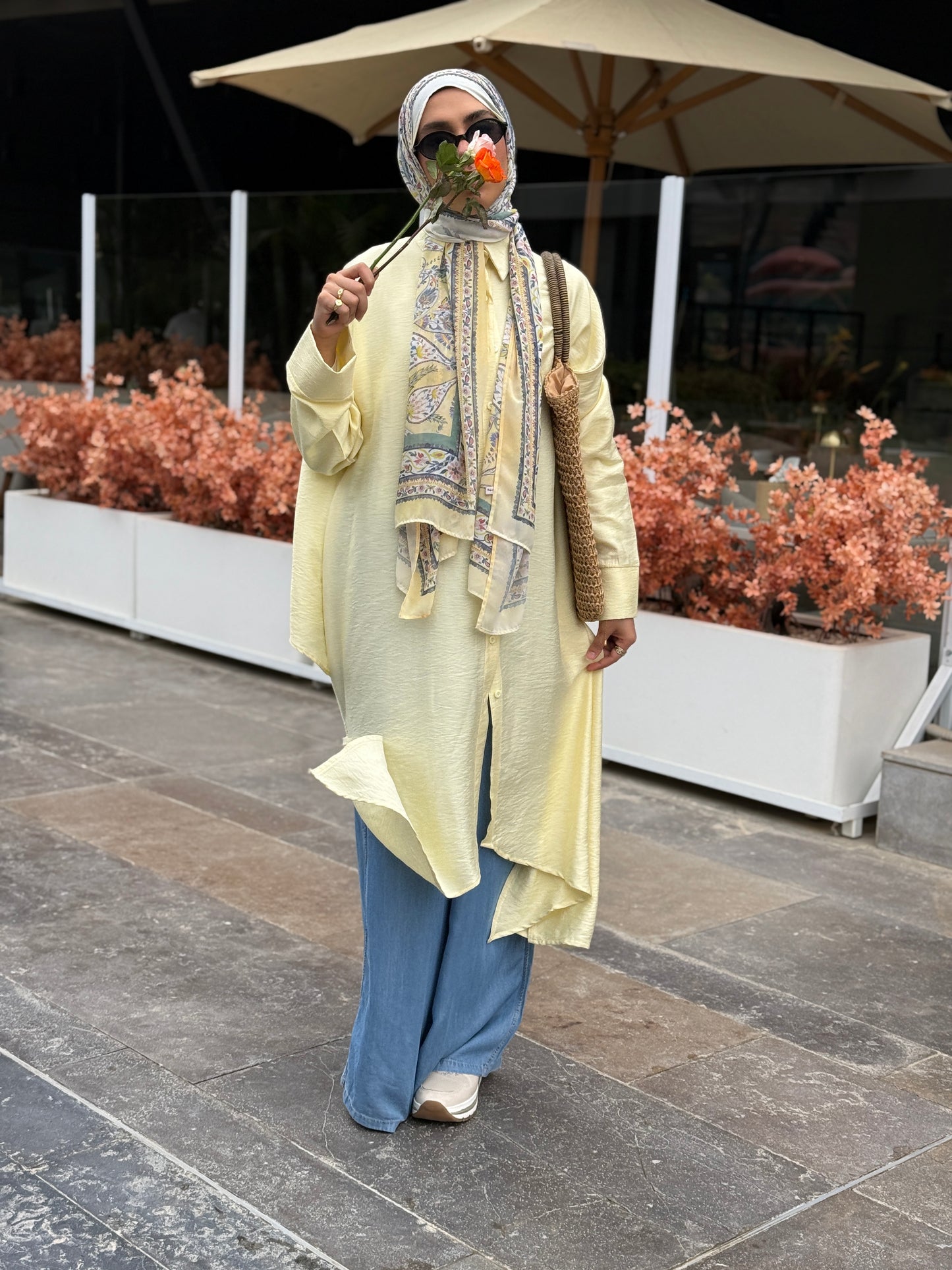Amenaa high-low shirt dress featuring a flowing silhouette and button details, perfect for casual or semi-formal wear.