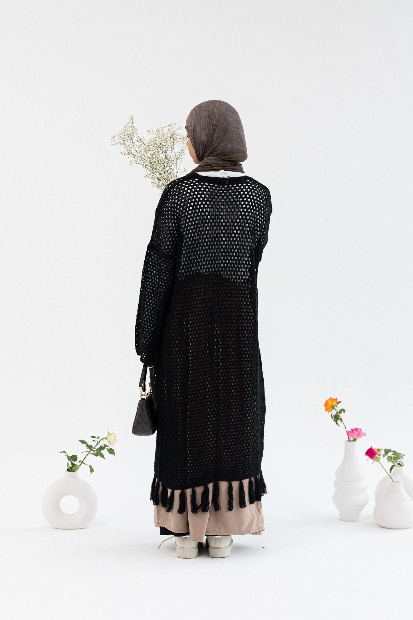 Amenaa crochet knit cardigan with a textured pattern, long sleeves, and open-front design in soft, cozy yarn.