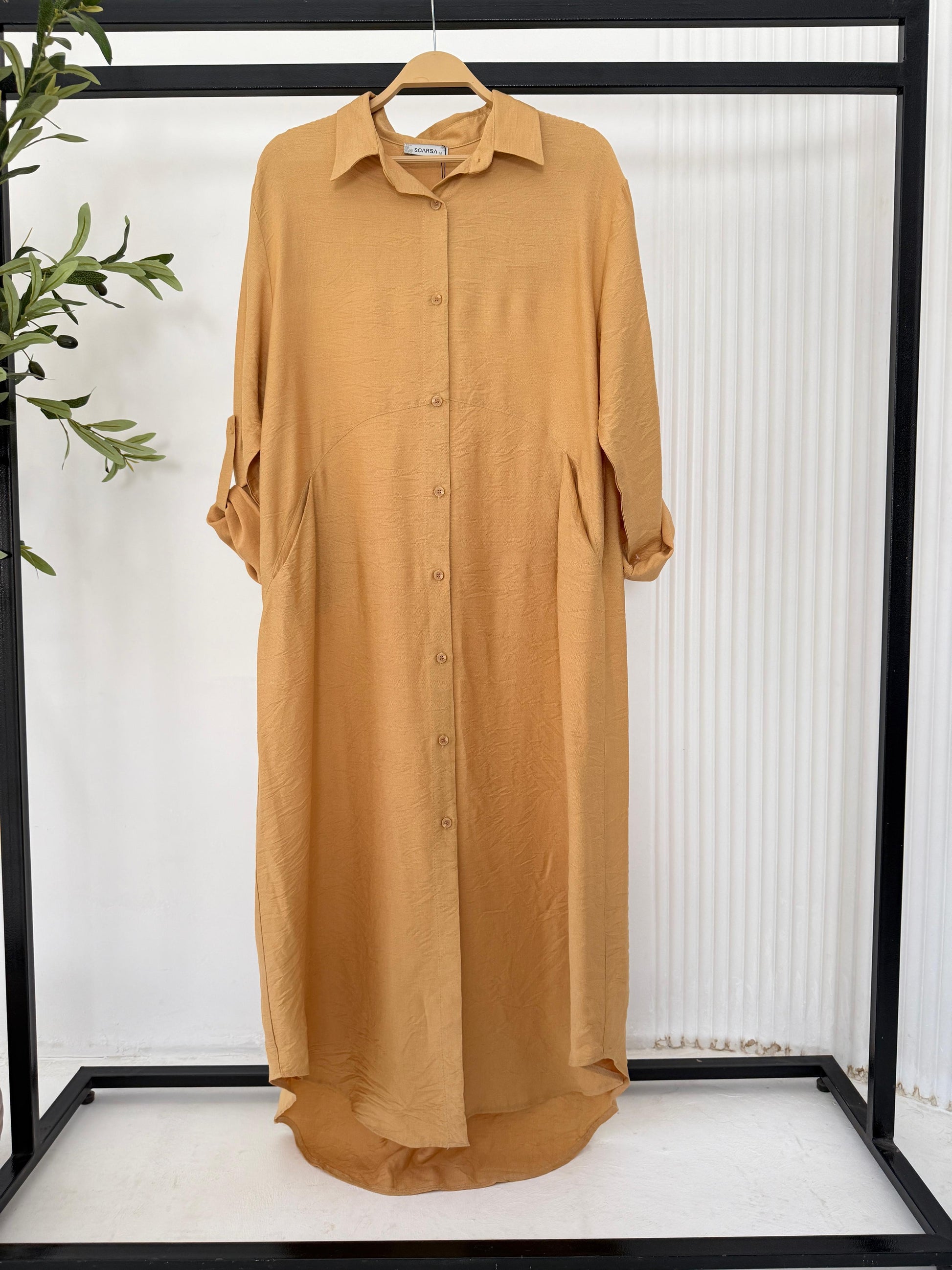 Amenaa shirt dress with long sleeves and a relaxed fit, featuring a classic collar and button-down front.