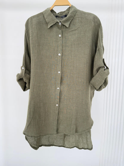 Amenaa linen shirt displayed on a hanger, showcasing lightweight, breathable fabric with a relaxed fit and classic collar.