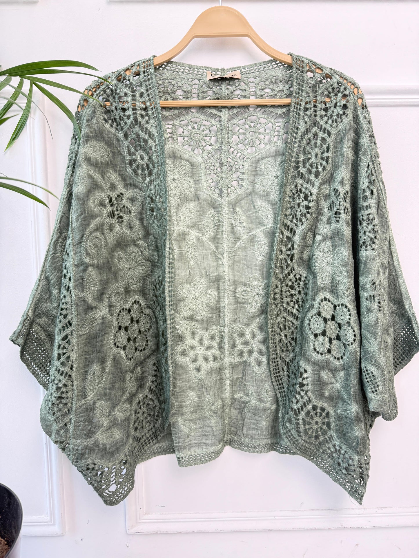 Amenaa boho crochet lace kimono with intricate patterns and lightweight fabric, perfect for casual or beachwear styles.