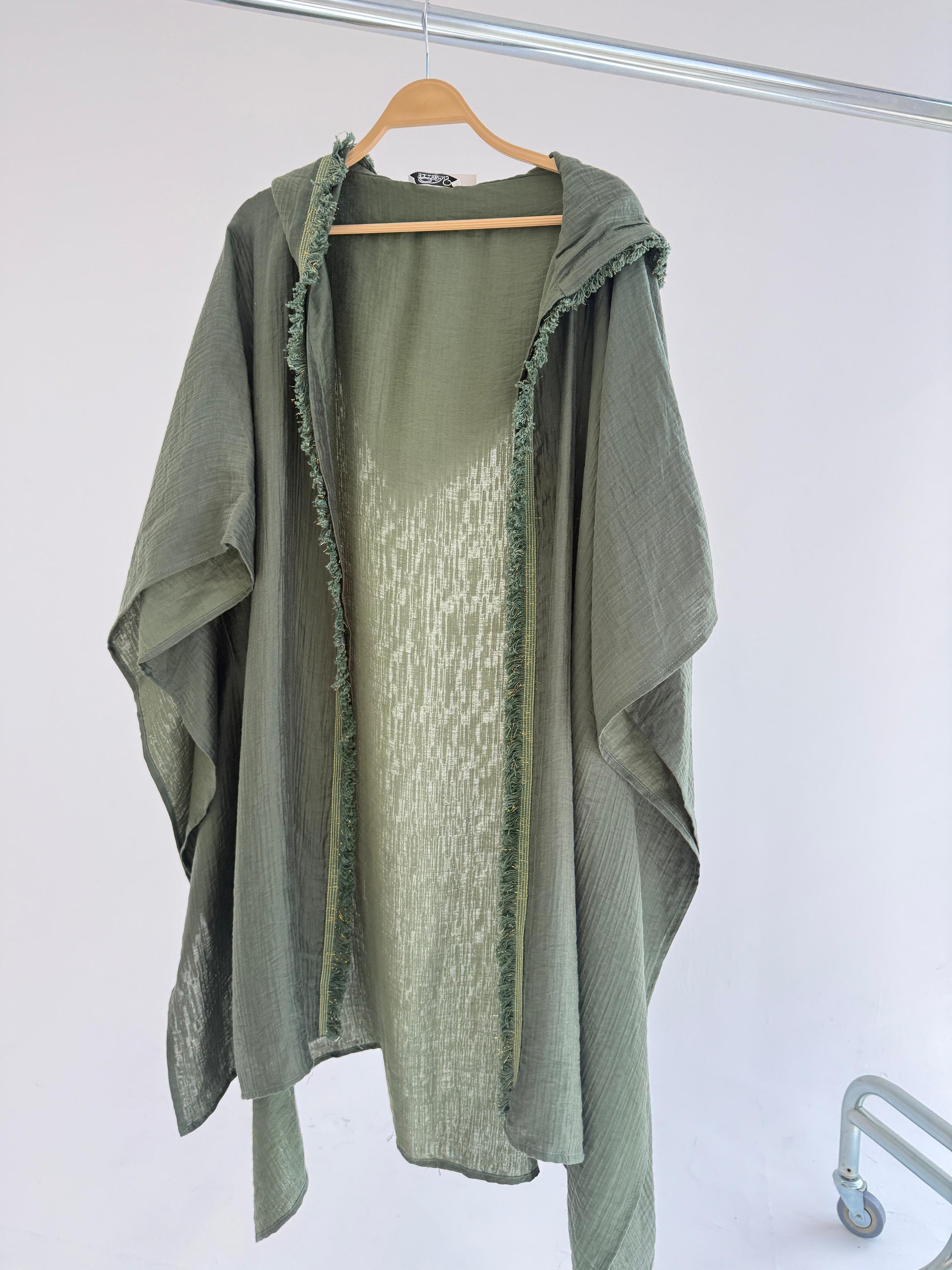 Light summer kimono by Amenaa with floral patterns, featuring flowing fabric and wide sleeves, perfect for warm weather wear.