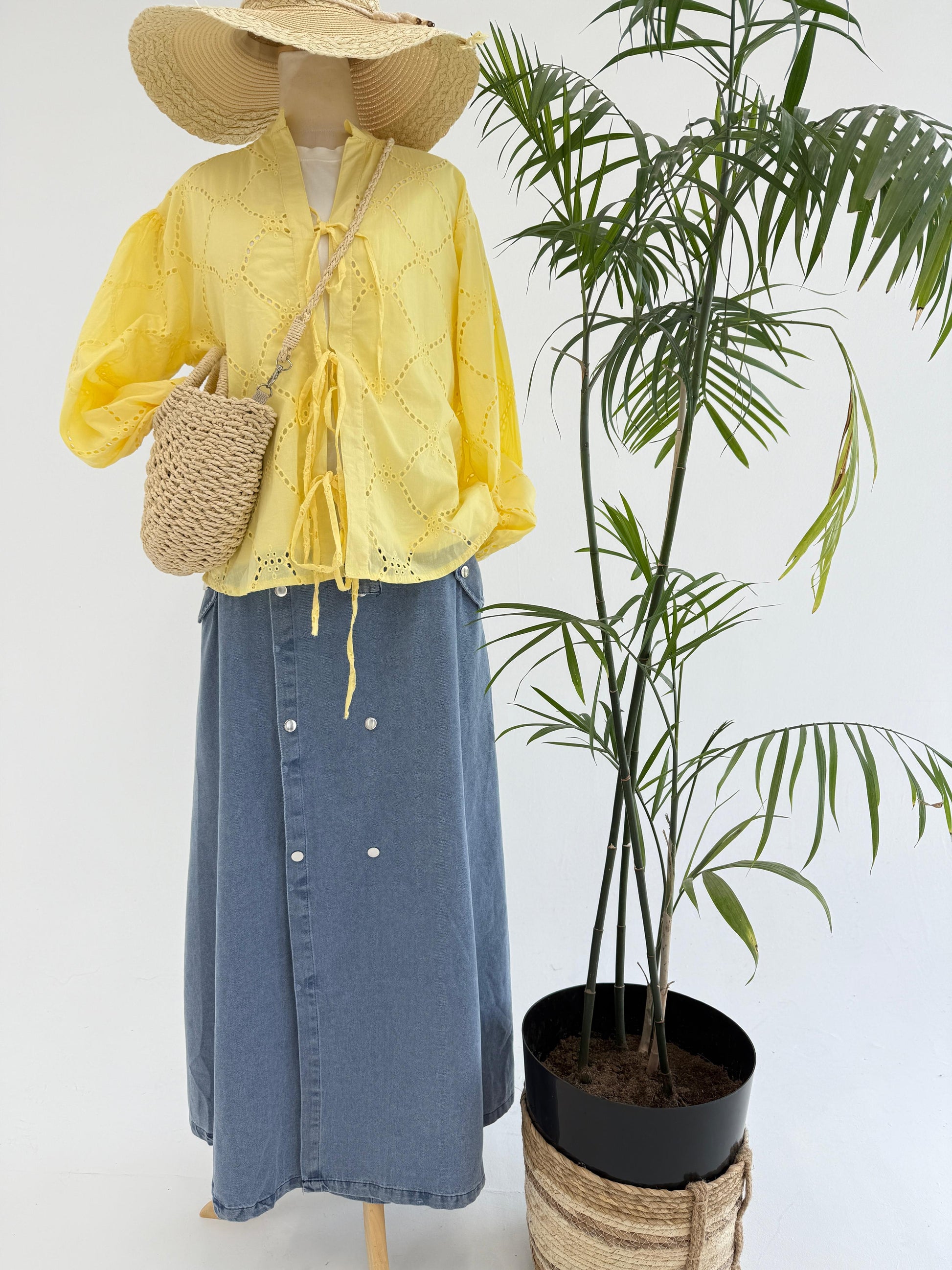 Amenaa Summer Rokama Tie Blouse in light fabric with a stylish tie detail and short sleeves, perfect for warm weather.