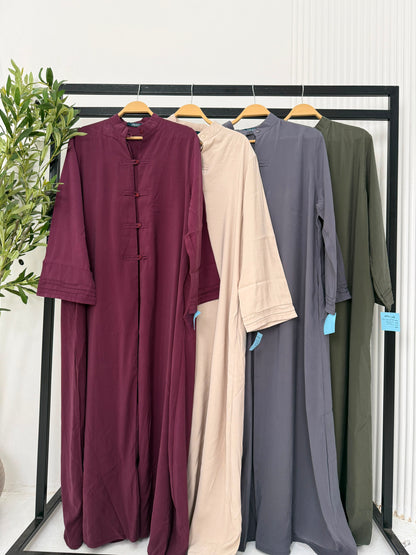 Amenaa modest Tencel dress displayed on a hanger with a flowing, lightweight fabric and a simple, elegant design.