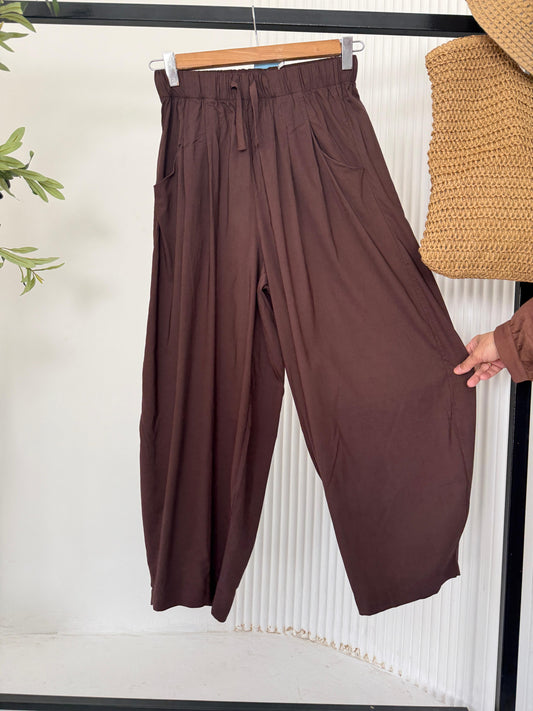 Amenaa Balloon Pants featuring a relaxed fit with a high waist and gathered cuffs, shown in a neutral fabric.
