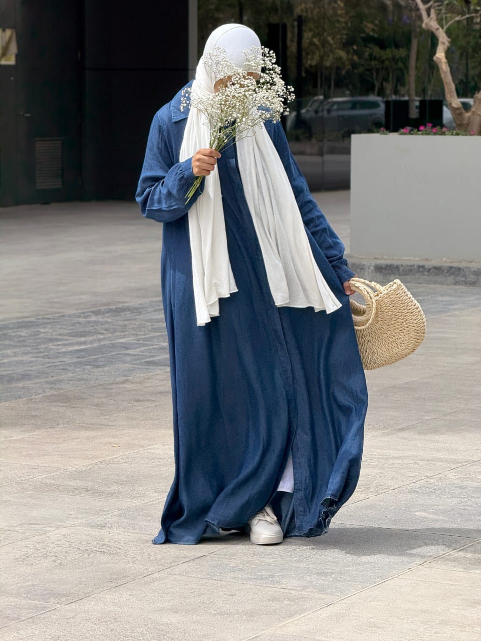 Amenaa maxi denim dress displayed on a model featuring a long, sleeveless design with a fitted waist and casual denim fabric.