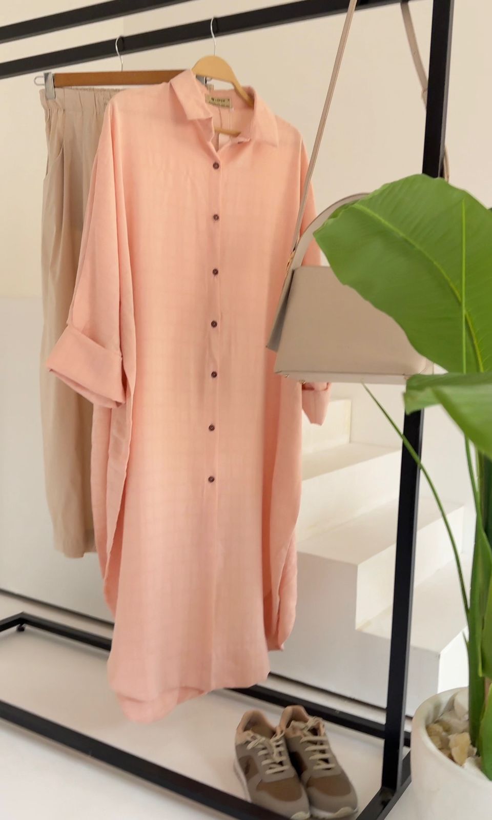 Amenaa textured oversized shirt dress displayed on a model, featuring a relaxed fit and detailed fabric texture.