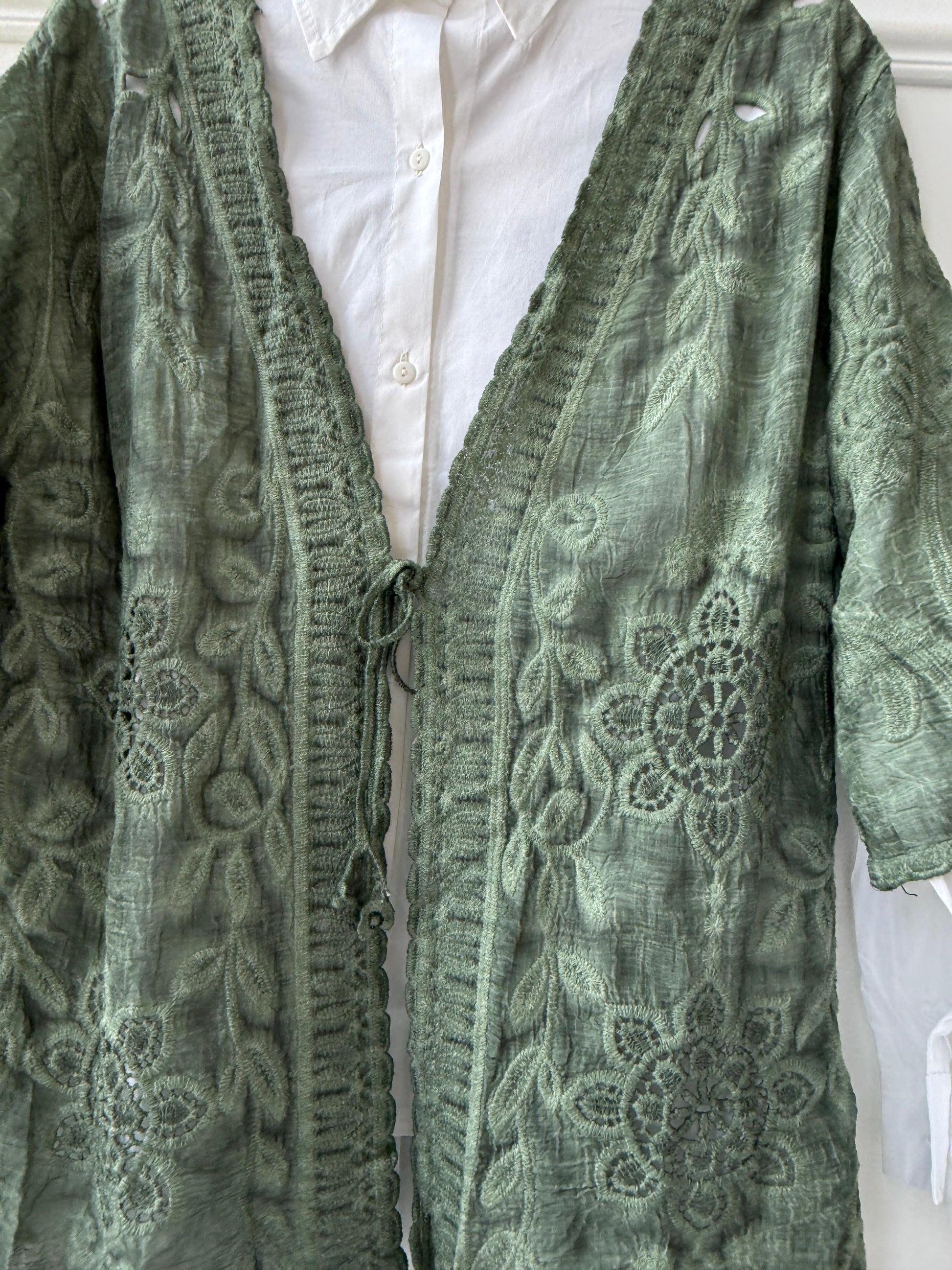 Embroidered lace kimono by Amenaa featuring intricate floral embroidery and delicate sheer fabric for elegant style.