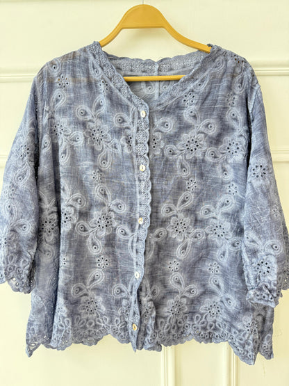 Amenaa Guipure Blouse 24/21/306 featuring intricate lace and elegant design, displayed on a hanger.