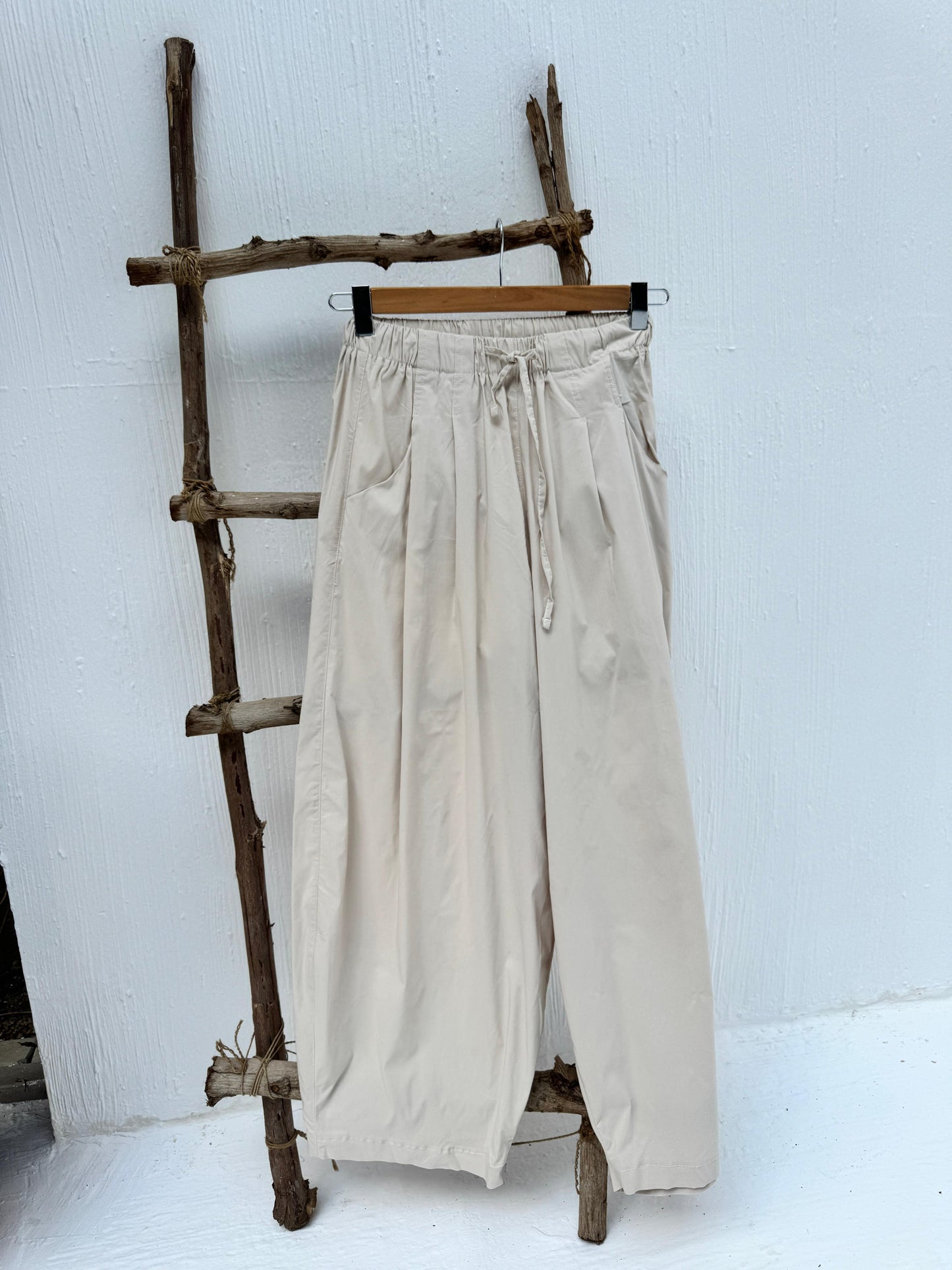 Amenaa balloon pants featuring a loose, oversized fit with gathered cuffs and stylish design, shown on a model.