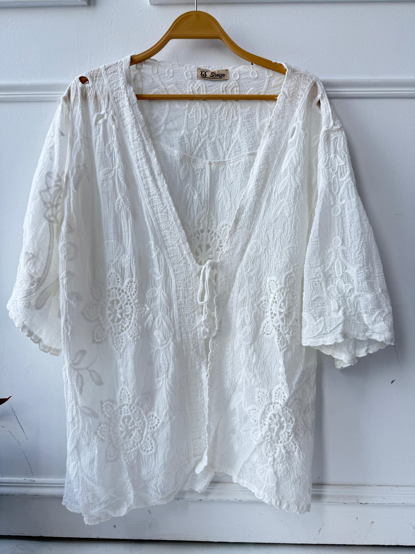 Amenaa embroidered lace kimono featuring delicate floral embroidery and flowing fabric, styled with open front and wide sleeves.