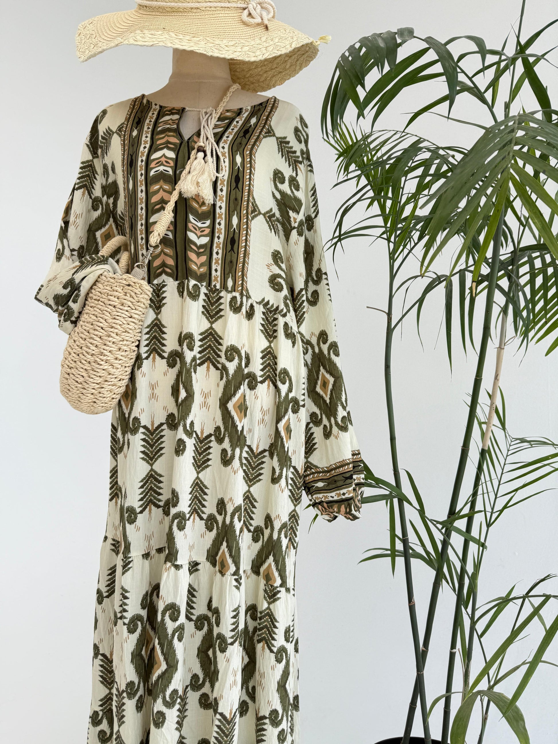 Amenaa boho pattern maxi dress featuring a flowing silhouette and vibrant floral designs, perfect for casual summer wear.