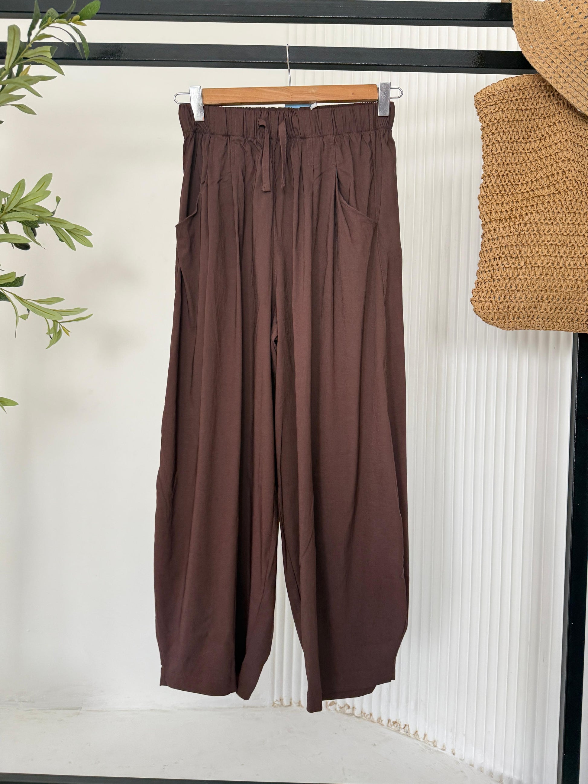 Amenaa balloon pants with a relaxed fit, featuring a high waist and soft fabric, shown in a neutral color.