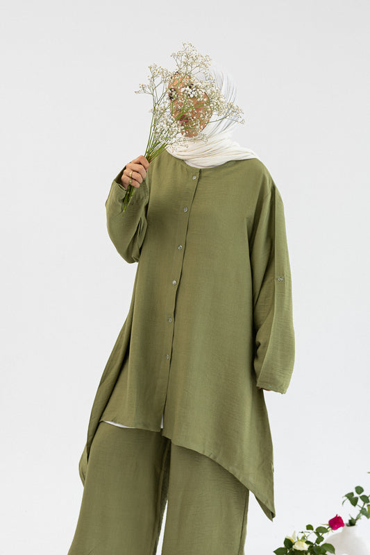 Amenaa Modest Set 1/12/13 featuring a stylish, modest clothing ensemble with layered fabric and elegant design details.