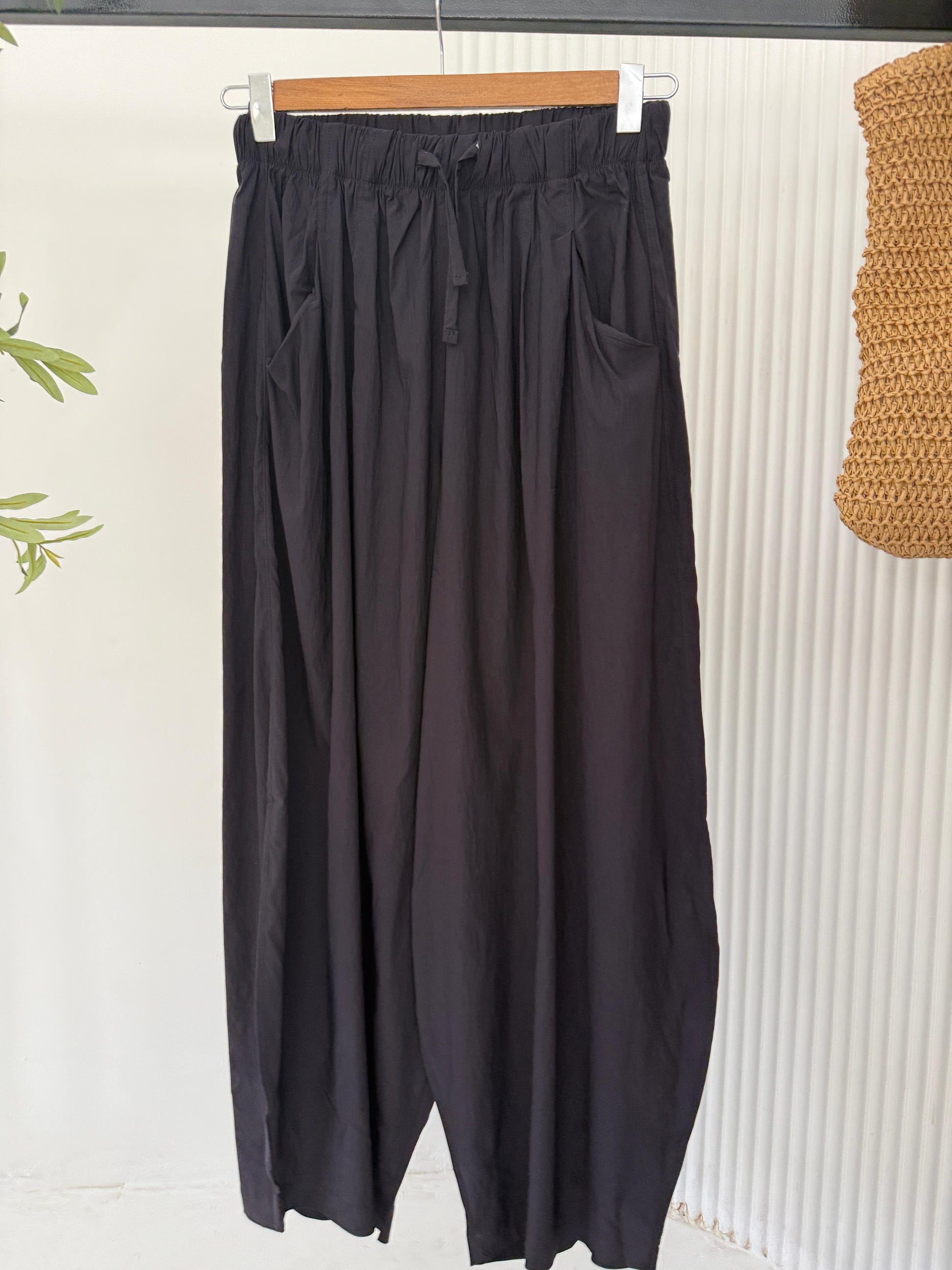 Amenaa Balloon Pants, stylish loose-fitting pants with a relaxed silhouette and gathered cuffs, shown in a neutral fabric.