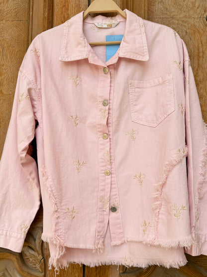 Amenaa flowery embroidered gabardine jacket with vibrant floral patterns and tailored fit, displayed on a hanger.