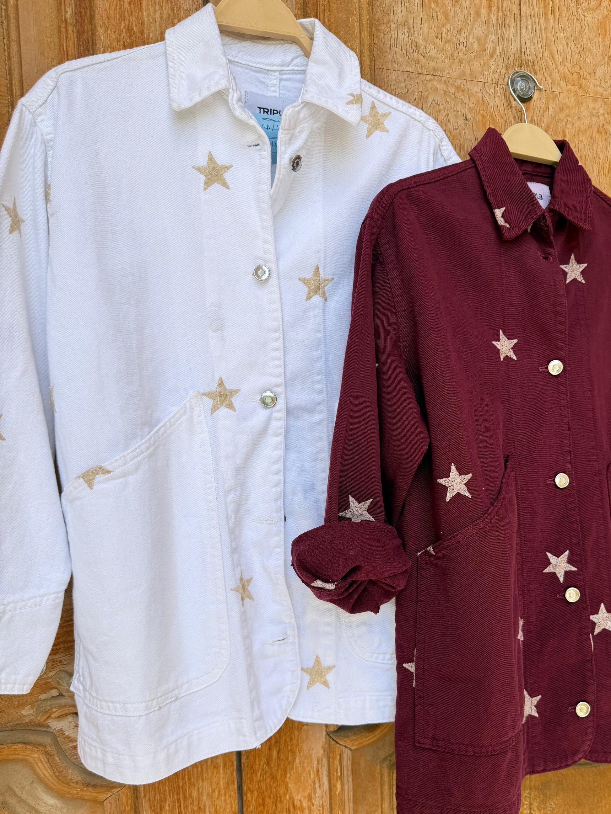 Amenaa Star Gabardine Jacket displayed on a hanger, featuring a classic design with star details and durable gabardine fabric.